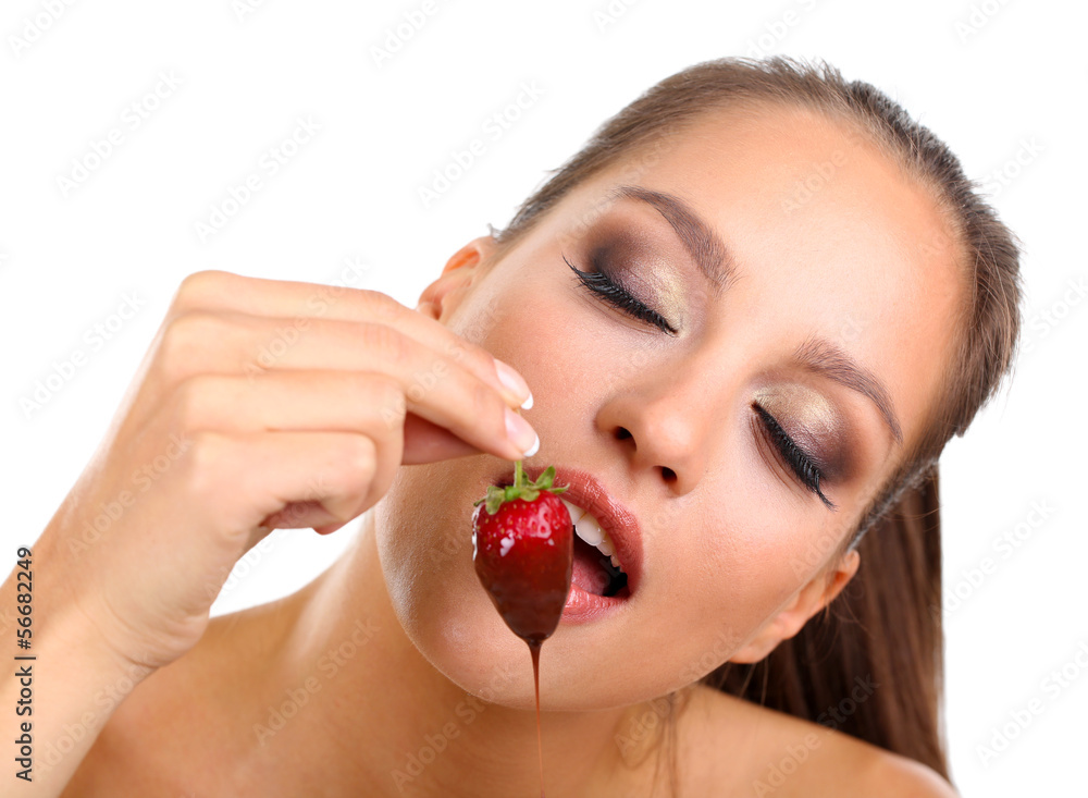 Portrait of beautiful young girl with strawberry in chocolate Portrait of beautiful young girl with strawberry in chocolate
