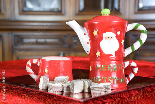 Teapot with cup and biscuits photo