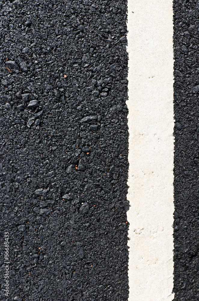 Fototapeta premium New asphalt road with white line