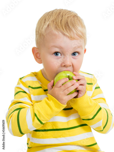 Kid boy eating green apple,...