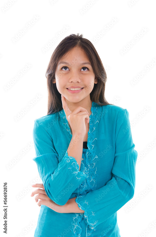 young muslim malay girl thinking with traditional dress young muslim malay girl thinking with traditional dress