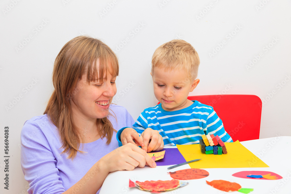 mother and son with play dough mother and son with play dough