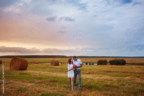 young loving couple on wheat field