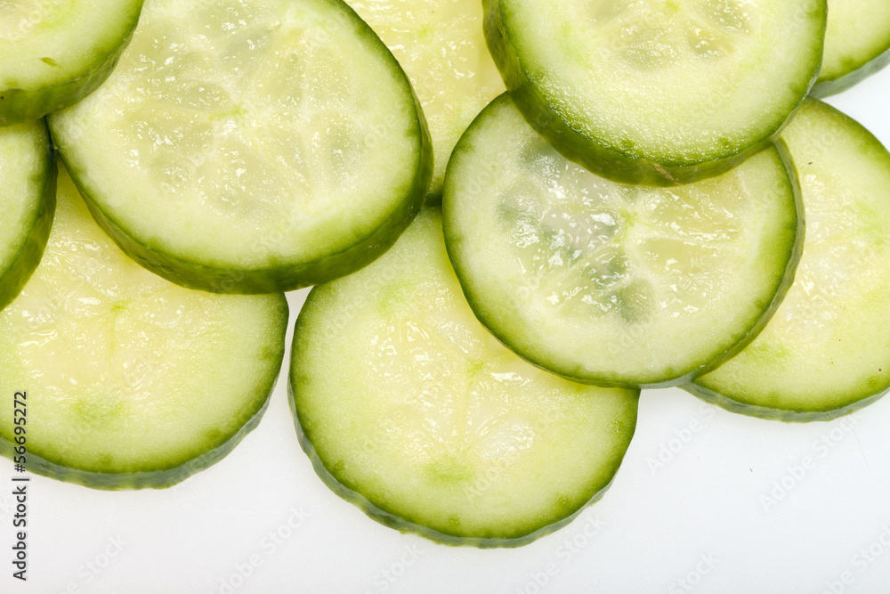Freshly sliced cucumber isolated on white background Freshly sliced cucumber isolated on white background