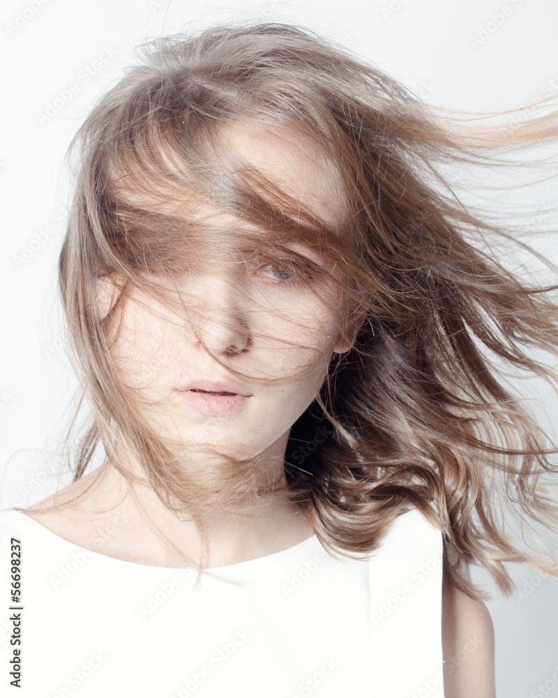 Portrait of a woman with wind in her hair. Portrait of a woman with wind in her hair.