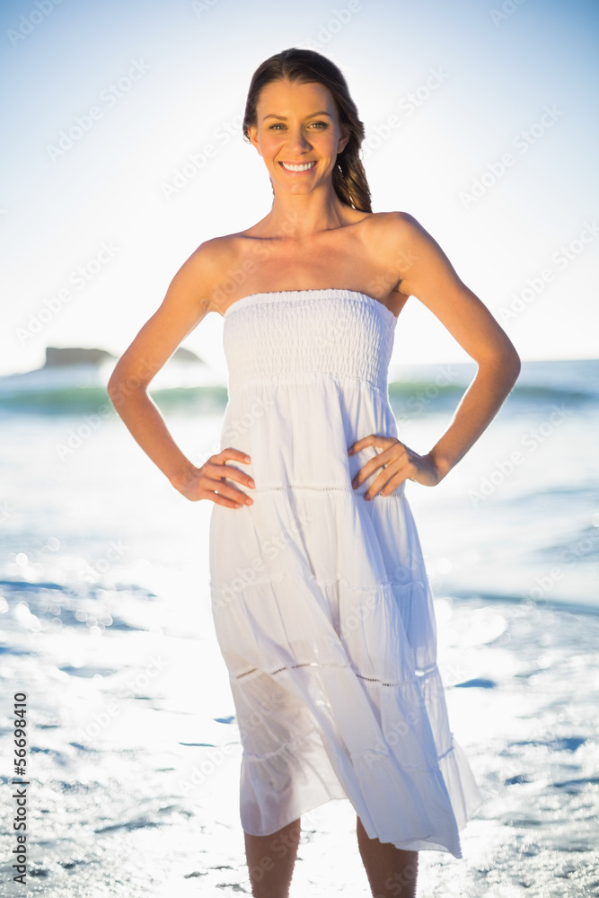 Beautiful brunette in white summer dress posing Beautiful brunette in white summer dress posing