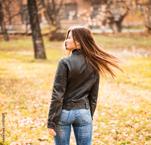 young woman portrait in autumn park