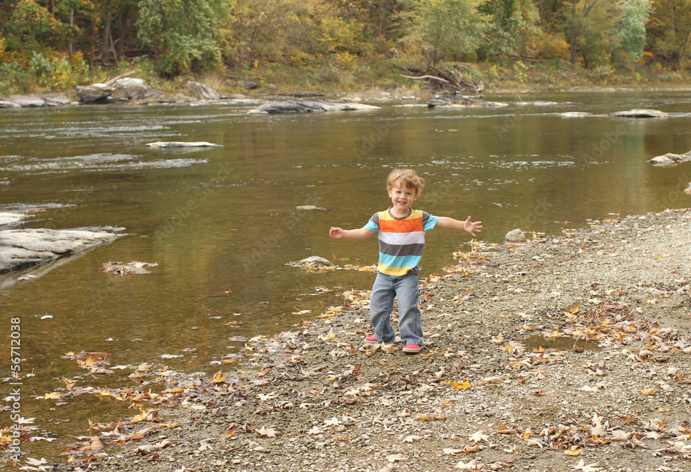 Child playing outside, fall season Child playing outside, fall season