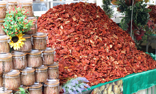 immense mountain of dried red ripe tomatoes for sale