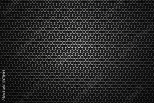 Black iron speaker grill texture. Industrial background photo