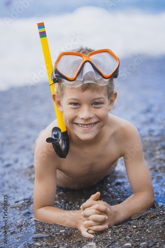 happy boy driver on the beach