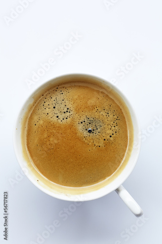 Fresh coffee in white cup,top view