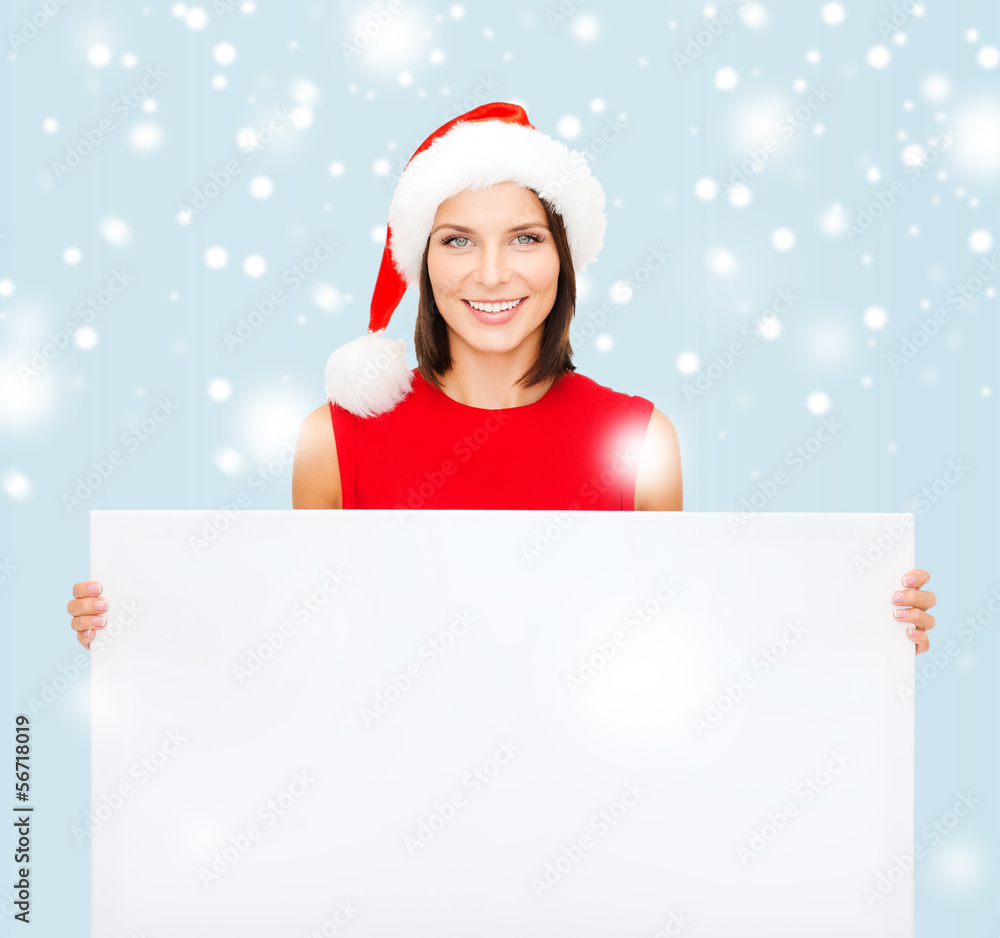 woman in santa helper hat with blank white board woman in santa helper hat with blank white board