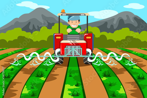 Farmer watering the farm with tractor