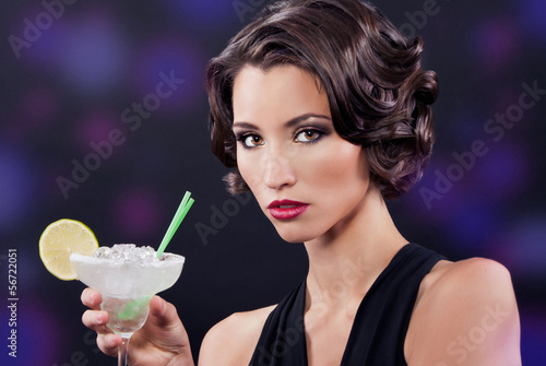 Fotografi Beautiful elegant girl with a martini glass