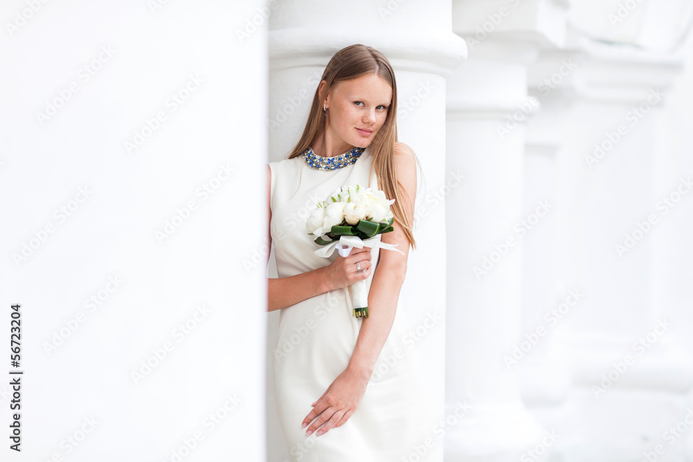 Portrait of beautiful bride holding white flowers Portrait of beautiful bride holding white flowers