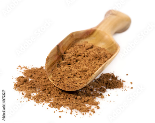 cocoa powder in a wooden scoop