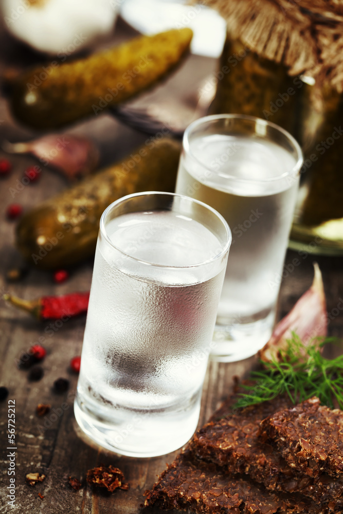 Russian vodka with traditional black bread and pickles Russian vodka with traditional black bread and pickles