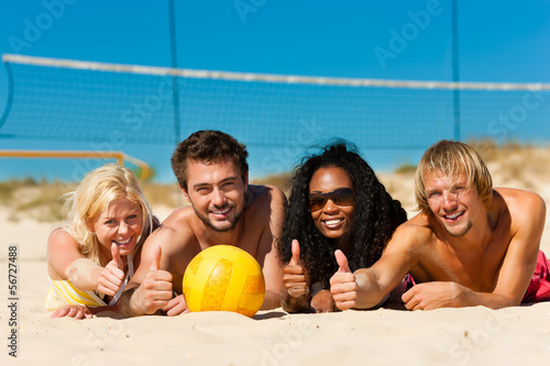 Friends playing Beach volleyball