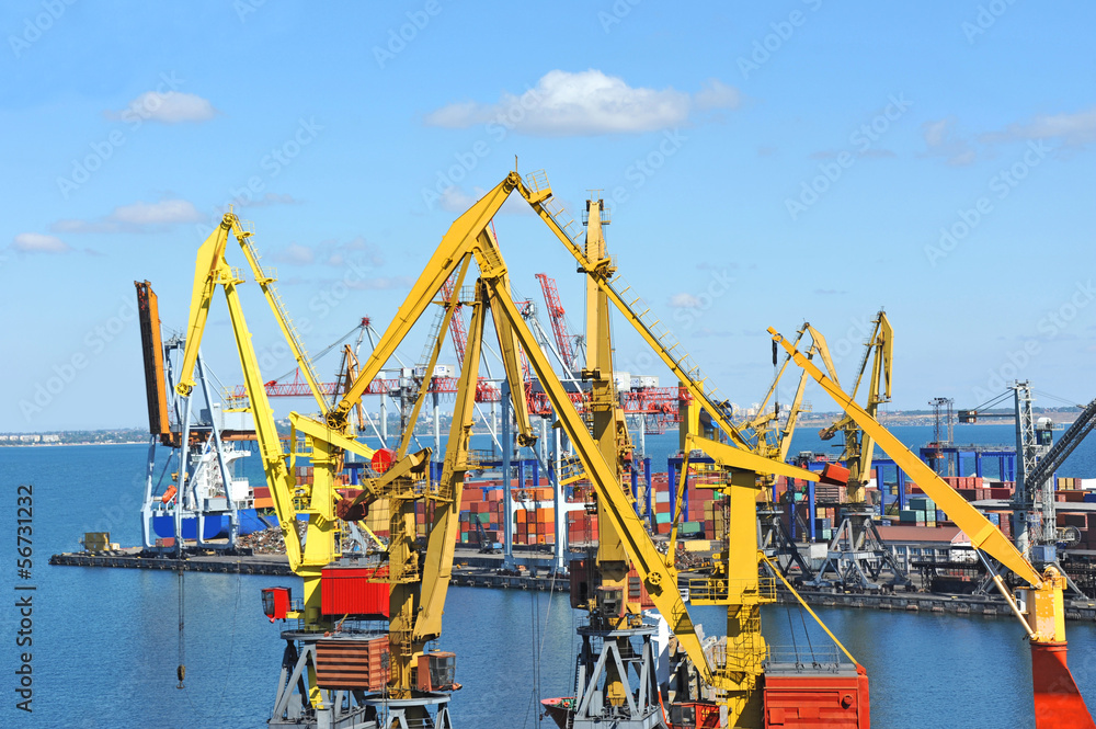 Container stack and cargo ship under crane bridge Container stack and cargo ship under crane bridge