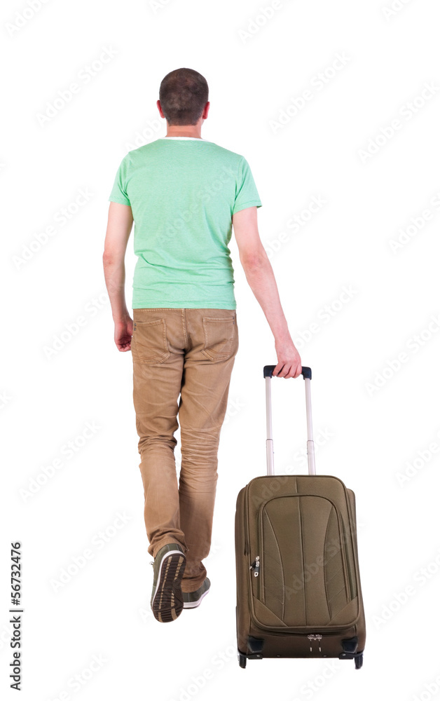 back view of walking man with suitcase. back view of walking man with suitcase.