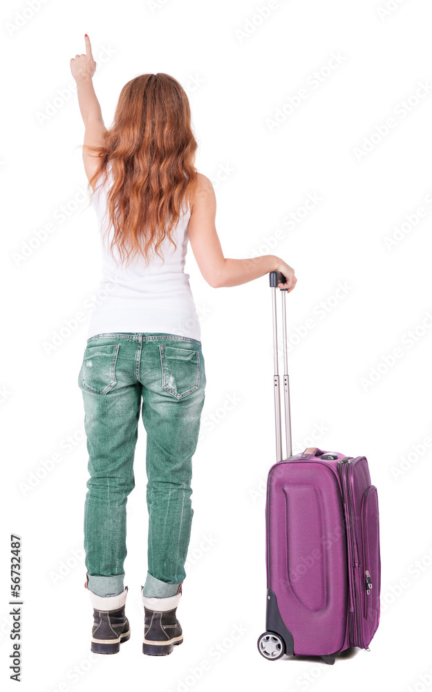 Back view of pointing woman with suitcase looking up Back view of pointing woman with suitcase looking up