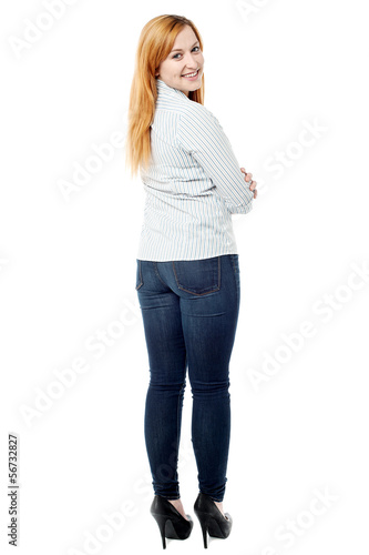 Attractive young woman turning back