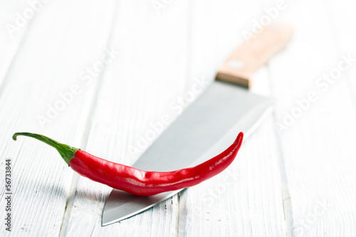 chili pepper on knife