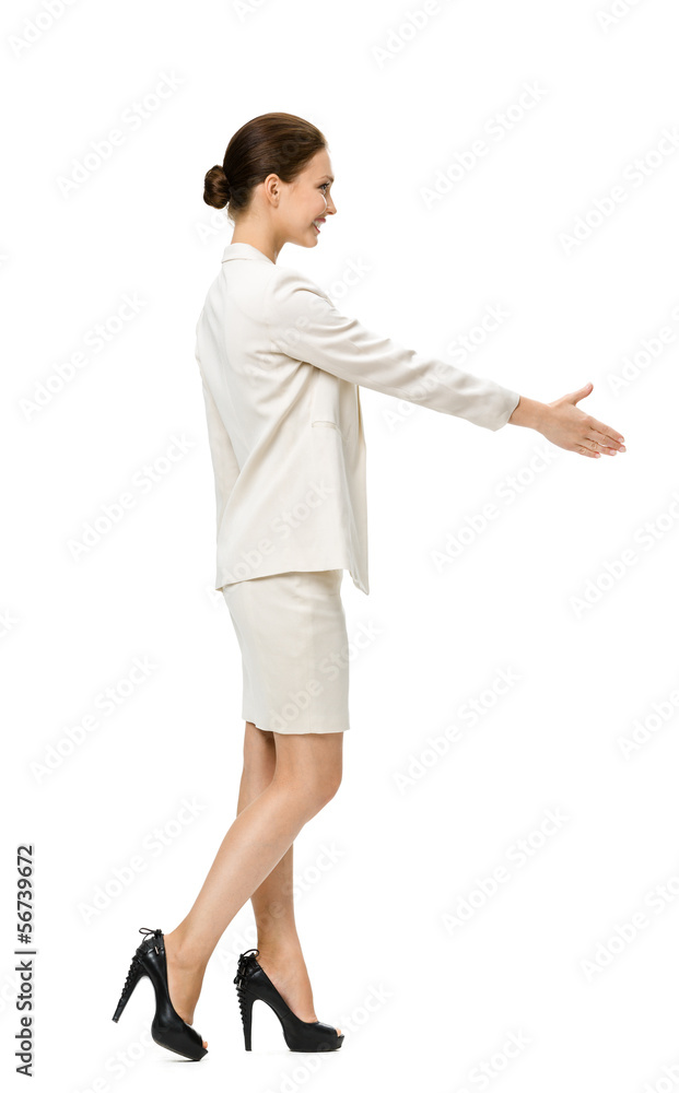 Full-length profile of businesswoman handshaking Full-length profile of businesswoman handshaking