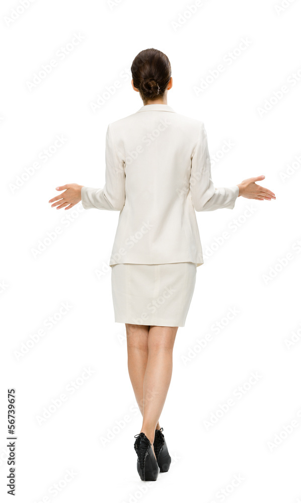 Full-length backview of business woman with outstretched arms Full-length backview of business woman with outstretched arms