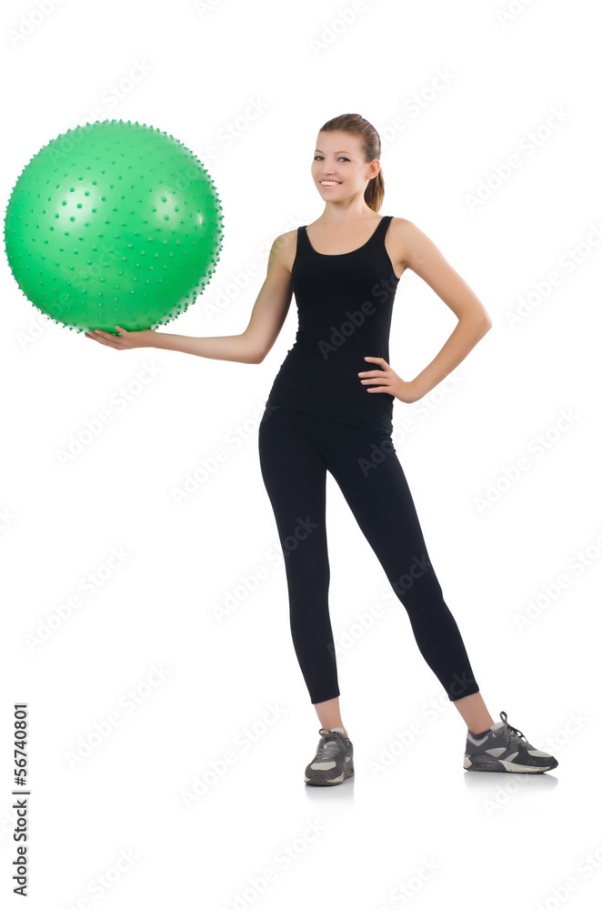 Young woman with ball exercising on whitee