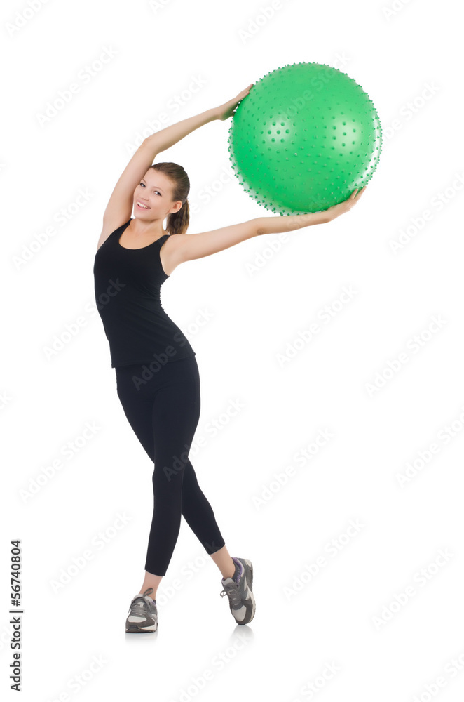 Young woman with ball exercising on whitee