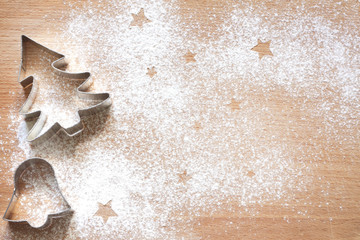 Abstract Christmas food background with cookies molds and flour