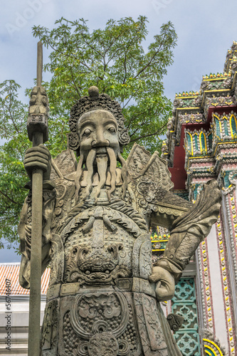 Chinese stone statue in Wat Pho, Bangkok, Thailand.Chinese stone