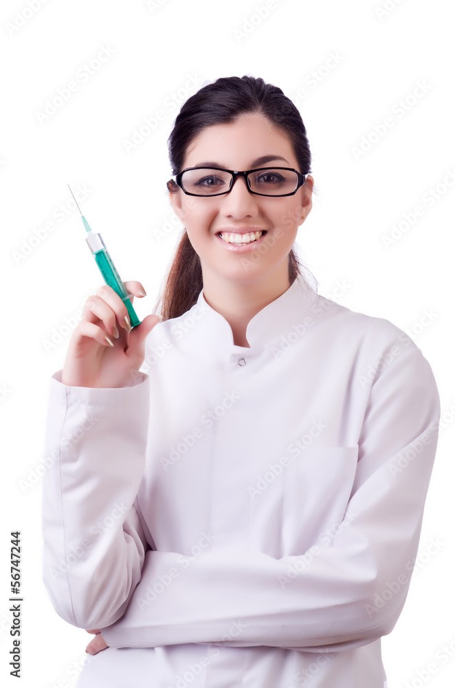 Woman doctor with syringe on white