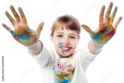 Girl showing colorful hands to camera