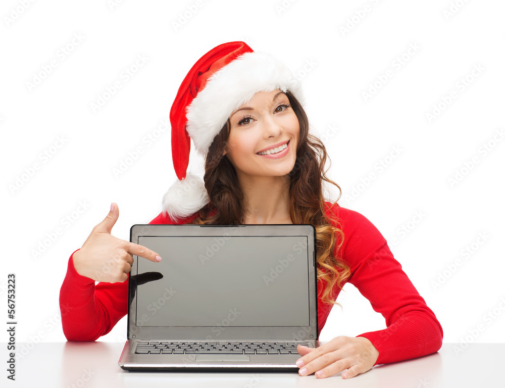 woman in santa helper hat with laptop computer woman in santa helper hat with laptop computer