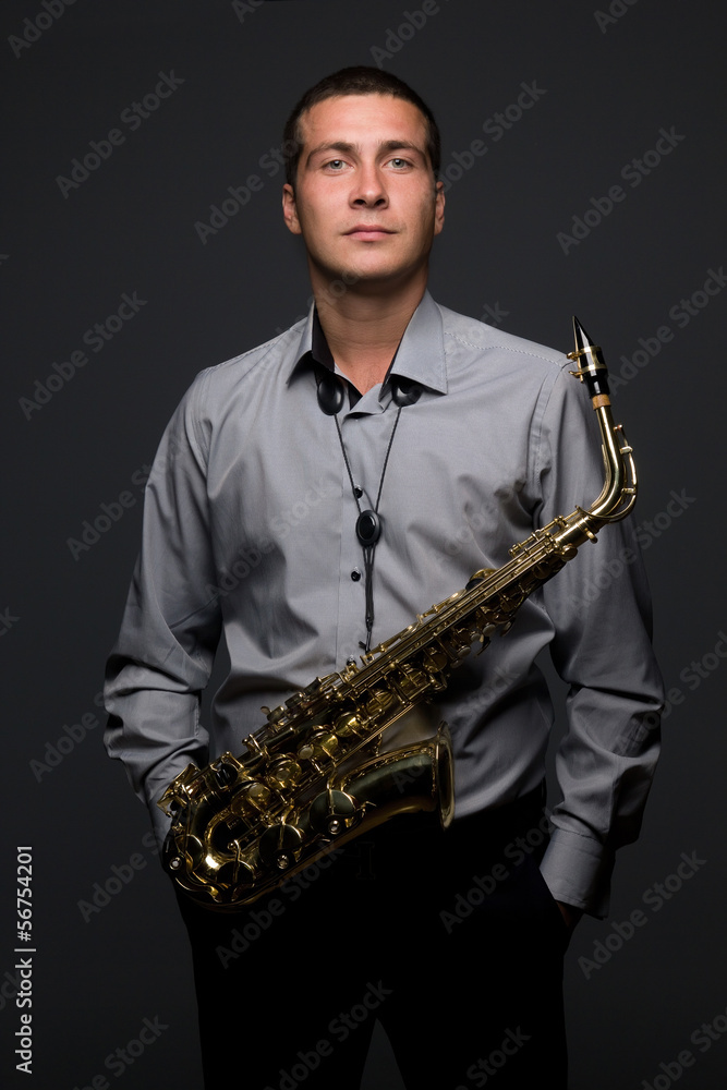 Naklejka premium Portrait of young saxophonist