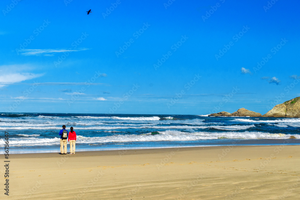 Happy couple on beautiful ocean beach, romantic vacation