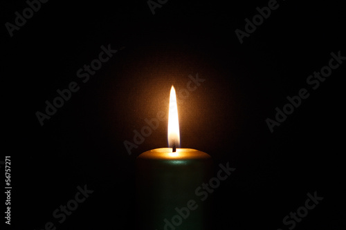 Burning gold candle