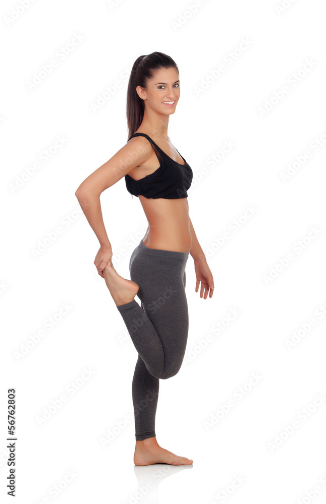Woman doing stretching exercises in a gym Woman doing stretching exercises in a gym