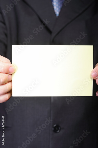 Close up of business note card in male hand