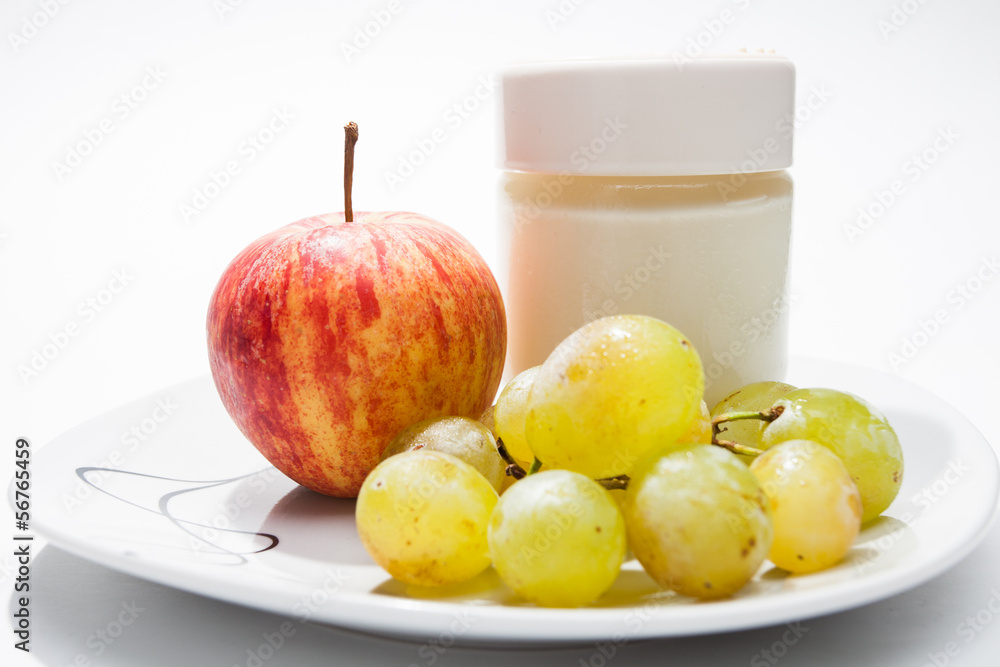 Dish with yogurt, apple and grapes Dish with yogurt, apple and grapes