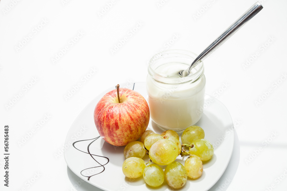 Dish with yogurt, apple and grapes Dish with yogurt, apple and grapes