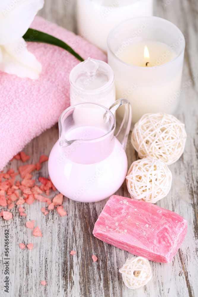 Beautiful spa setting with lily on wooden table close-up Beautiful spa setting with lily on wooden table close-up