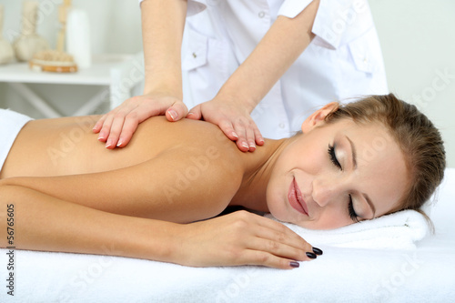 Beautiful young woman having back massage close up © Africa Studio