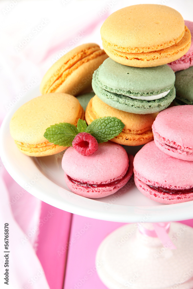 Gentle macaroons in vase on table close-up