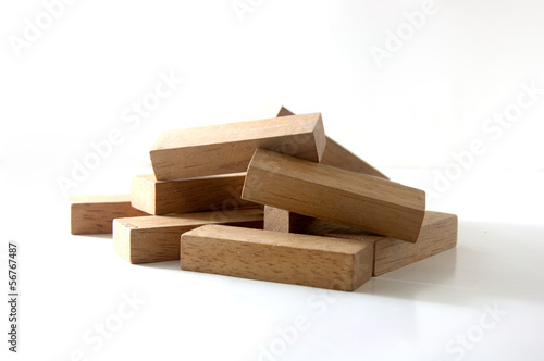 construction from wooden cubes. It is isolated on a white backgr