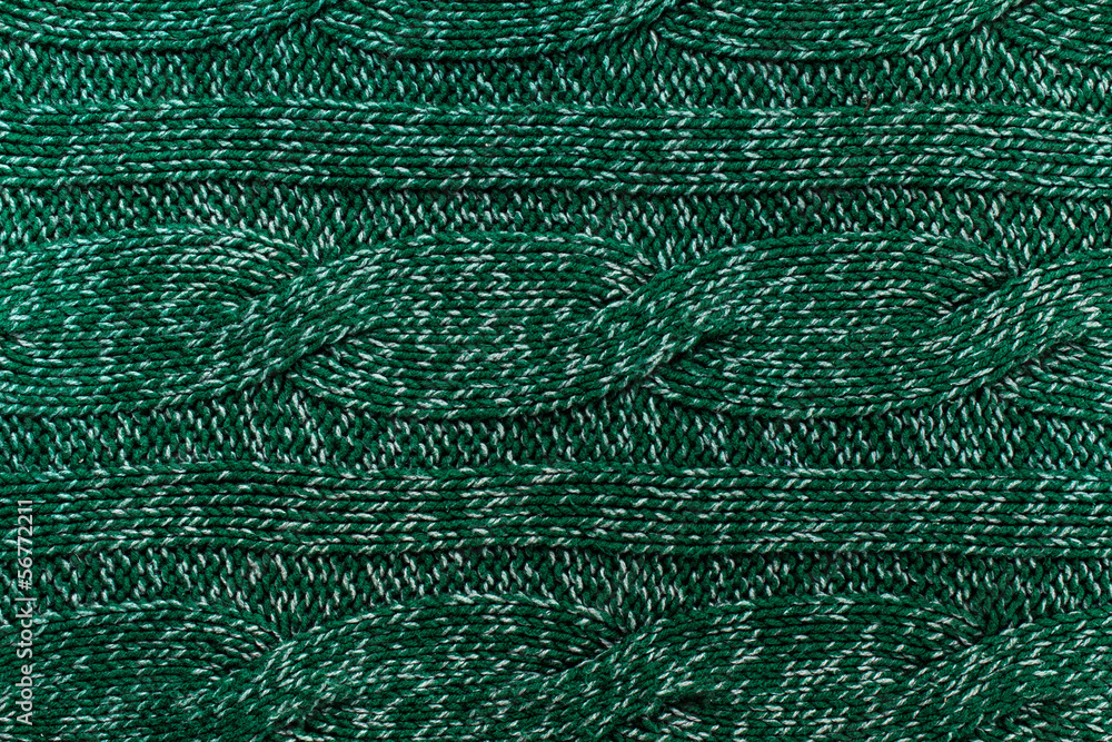 knitted jersey green background with a relief pattern. High reso