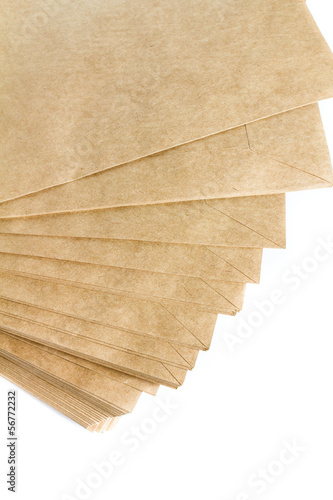 Stack Of Recycled Paper envelopes isolated on white background,